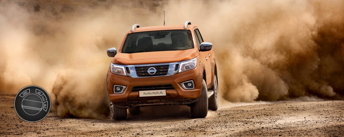 Nissan Navara driving shot in the desert with 4 wheel drive low illustration